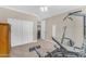 Home gym with weight training equipment and large wardrobe; ample space to workout at 824 W Whitten St, Chandler, AZ 85225
