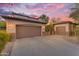 Grand home exterior boasts a three car garage, stone accents, and a well-manicured yard at 824 W Whitten St, Chandler, AZ 85225