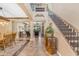 Spacious foyer boasts soaring ceilings, hardwood floors, and a grand staircase leading to the second level at 824 W Whitten St, Chandler, AZ 85225