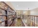 Bright hallway with hardwood floors, a bookshelf, and natural lighting at 824 W Whitten St, Chandler, AZ 85225