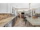 Open concept kitchen with granite counters, island with seating, and stainless steel appliances at 824 W Whitten St, Chandler, AZ 85225