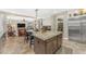 Kitchen island with granite countertop, storage, and seating, perfect for entertaining at 824 W Whitten St, Chandler, AZ 85225