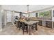 Updated kitchen with a central island, granite countertops, and custom lighting at 824 W Whitten St, Chandler, AZ 85225