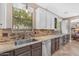 Kitchen with granite countertops, stainless steel sink, and bright window at 824 W Whitten St, Chandler, AZ 85225