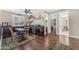 A charming dining area featuring dark wood floors, a small table, and stainless steel appliances at 824 W Whitten St, Chandler, AZ 85225