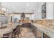Spacious kitchen with granite countertops, stainless steel appliances and large center island at 824 W Whitten St, Chandler, AZ 85225