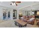 Open-concept living space features a leather sofa, industrial coffee table, and seamless flow to the kitchen at 824 W Whitten St, Chandler, AZ 85225