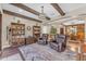 Inviting living room featuring bookcases, leather chairs, and a decorative rug at 824 W Whitten St, Chandler, AZ 85225