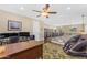 Bright upstairs office space with hardwood floors, a fan, and a comfortable massage chair at 824 W Whitten St, Chandler, AZ 85225