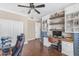 Bright home office with built-in storage, desk, and hardwood floors, ideal for remote work at 824 W Whitten St, Chandler, AZ 85225