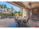 Cozy covered patio area featuring a table with chairs, offering views of the inviting pool at 824 W Whitten St, Chandler, AZ 85225