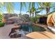 Resort-style pool featuring a basketball hoop, rock waterfall, and an inviting daybed at 824 W Whitten St, Chandler, AZ 85225