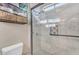 Modern shower features marble tile, glass doors, pebble floor, and spa-like finishes at 824 W Whitten St, Chandler, AZ 85225