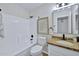 A well-lit bathroom features granite counters and a shower over tub at 8501 W Highland Ave, Phoenix, AZ 85037