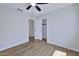 This bedroom features wood floors, a closet, and neutral paint at 8501 W Highland Ave, Phoenix, AZ 85037