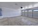 A spacious garage with an automatic door and water heater at 8501 W Highland Ave, Phoenix, AZ 85037