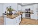 A kitchen featuring granite counters, stainless steel appliances, and modern white cabinetry at 8501 W Highland Ave, Phoenix, AZ 85037