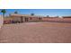 Spacious gravel backyard with fence and block patio at 8818 W Pinchot Ave, Phoenix, AZ 85037