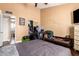 Bedroom with closet and a TV on top of a dresser, featuring a neutral color scheme and a bed at 8818 W Pinchot Ave, Phoenix, AZ 85037