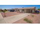 Lovely single-story home featuring a covered carport and simple, attractive landscaping at 8818 W Pinchot Ave, Phoenix, AZ 85037