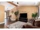 Comfortable living room with warm paint, hardwood flooring, and modern decor at 8818 W Pinchot Ave, Phoenix, AZ 85037