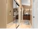 Hallway showcasing bathrooms on each side with granite counters and a shared mirror to enhance space at 882 N Concord Ave, Chandler, AZ 85225