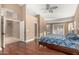 Bright bedroom features wood floors, neutral walls, and ample natural light from windows and glass doors at 882 N Concord Ave, Chandler, AZ 85225
