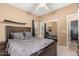 Relaxing bedroom featuring a queen-sized bed, closet with sliding mirror doors and soft, neutral decor at 882 N Concord Ave, Chandler, AZ 85225