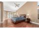 Spacious bedroom with vaulted ceilings, wood floors, and access to the backyard through glass doors at 882 N Concord Ave, Chandler, AZ 85225