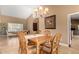 Traditional dining room with chandelier, six chairs and wood table that provides a warm and inviting space at 882 N Concord Ave, Chandler, AZ 85225