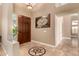 Welcoming foyer with a decorative tile inlay, dark wood front door, and access to the home's layout at 882 N Concord Ave, Chandler, AZ 85225