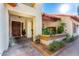 Inviting front entrance with covered porch, tiled flooring, and decorative plants enhancing the curb appeal at 882 N Concord Ave, Chandler, AZ 85225