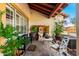 Cozy front porch with stone tile, outdoor seating, and a decorative water feature, perfect for relaxation at 882 N Concord Ave, Chandler, AZ 85225