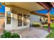 Covered patio with tile flooring, a French door, and a view of the landscaped backyard at 882 N Concord Ave, Chandler, AZ 85225