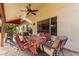 Covered patio featuring comfortable seating, a ceiling fan, and a view of the backyard at 882 N Concord Ave, Chandler, AZ 85225
