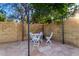 Private outdoor patio area with stone flooring and a charming seating arrangement at 882 N Concord Ave, Chandler, AZ 85225
