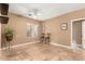 Spacious room with neutral-toned walls, tile flooring, a ceiling fan, and a window for natural light at 882 N Concord Ave, Chandler, AZ 85225