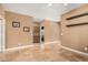 Room with tile floors and neutral-toned walls, featuring cabinets and wall shelves for storage at 882 N Concord Ave, Chandler, AZ 85225