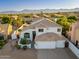 An aerial view of the property, showing the home's architecture and mountain views at 13 W Silverwood Dr, Phoenix, AZ 85045