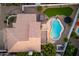 Stunning aerial view of backyard featuring a refreshing pool, neat landscaping, and tile roof at 13 W Silverwood Dr, Phoenix, AZ 85045