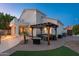 View of the backyard featuring a pergola, patio, and lush landscaping at 13 W Silverwood Dr, Phoenix, AZ 85045