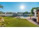 Expansive backyard featuring lush artificial turf, a fenced pool, and a trampoline for outdoor fun at 13 W Silverwood Dr, Phoenix, AZ 85045