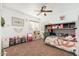bedroom with a bunk bed, ceiling fan, and decorated with playful decor at 13 W Silverwood Dr, Phoenix, AZ 85045