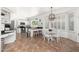 Open floor plan featuring the dining area and kitchen with island and bar stool seating at 13 W Silverwood Dr, Phoenix, AZ 85045
