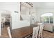 Spacious dining area with dark table and white chairs next to the staircase at 13 W Silverwood Dr, Phoenix, AZ 85045