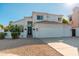 Inviting stucco home featuring a tile roof, desert landscaping, and a two-car garage at 13 W Silverwood Dr, Phoenix, AZ 85045