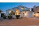 Two-story stucco home with a two-car garage and tile roof, featuring desert landscaping at 13 W Silverwood Dr, Phoenix, AZ 85045