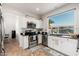 Bright kitchen with stainless steel appliances, tile backsplash, and a view to the backyard at 13 W Silverwood Dr, Phoenix, AZ 85045