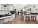 Spacious kitchen with stainless steel appliances, black countertops, and a breakfast bar with stools at 13 W Silverwood Dr, Phoenix, AZ 85045