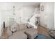 Open-concept living area with stairs, light gray sofa, and decor at 13 W Silverwood Dr, Phoenix, AZ 85045